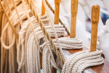 Old fashioned harbor marina sail boat ropes. Yachting details and objects concept.の写真素材