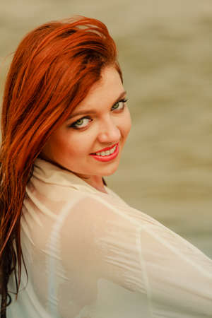 Beauty of ginger hair concept. Portrait of beautiful happy redhead adult woman.