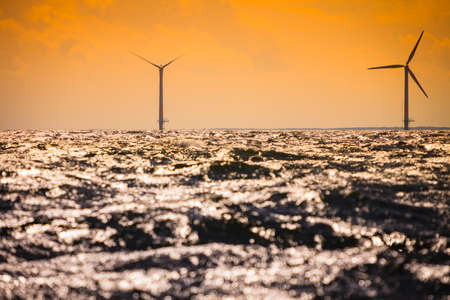 Wind turbines generator farm for renewable sustainable and alternative energy production along coast baltic sea near Denmark. Eco power, ecology.の写真素材