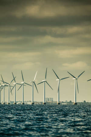 Vertical axis wind turbines generator farm for renewable sustainable and alternative energy production along coast baltic sea near Denmark. Eco power, ecology.の写真素材