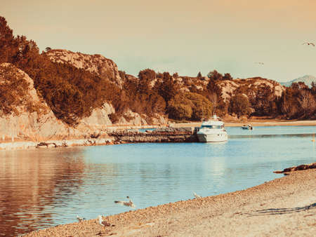 Tourism, vacation and travel. Tranquil scene of norway sea, cliffs during sunny weather.