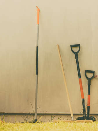 Shovel spade work tools standing outside. Gardening and agricultural equipment essentials concept.の写真素材
