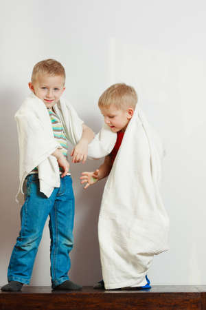 Childhood, relationship between brothers concept. Two little boys siblings playing together with...