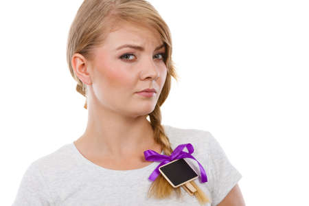 School, education, learning concept. Teenage blonde girl having little blackboards in hair.の写真素材