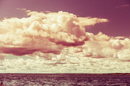 Colorful sunset over evening sea horizon, clouds sky. Tranquil scene. Natural background. Landscape. View from yachtの写真素材