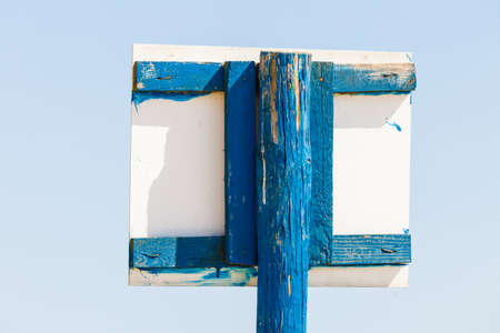 Various objects concept. Blue and white steel sign on blue sky backgroundの写真素材