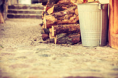 Firewood, home heating concept. Pile of cutted wood standing outside, outdoor shot.の写真素材