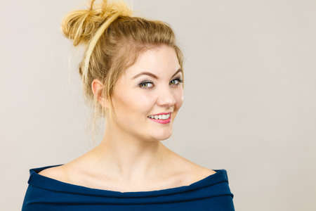 Happiness face expressions concept. Portrait of happy cheerful blonde woman smiling with joyの写真素材