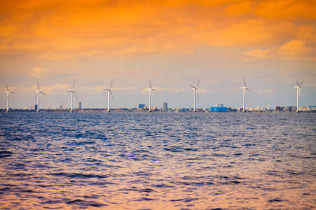Wind turbines generator farm for renewable sustainable and alternative energy production along coast baltic sea near Denmark. Eco power, ecology.の写真素材