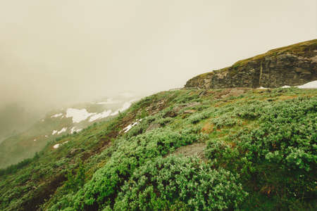 Norwegian scenic mountains landscape in summer hazy rainy day, hiking area between Aurland and Laerdal in Norwayの写真素材