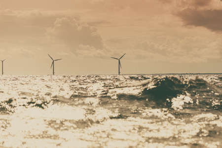 Vertical axis wind turbines generator farm for renewable sustainable and alternative energy production along coast baltic sea near Denmark. Eco power, ecology.の写真素材