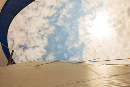 Detailed closeup of sail fabric on sailboat, outdoor shot. Marine objects concept.の写真素材