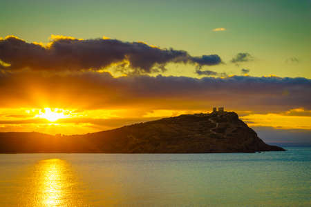 Greece Cape Sounion. Ruins of an ancient temple of Poseidon at morning sunrise, view from distance,の写真素材