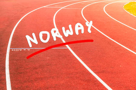 Empty red running track in stadium closeupの写真素材