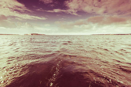 Colorful sunset over evening sea horizon, clouds sky. Tranquil scene. Natural background. Landscape. View from yachtの写真素材
