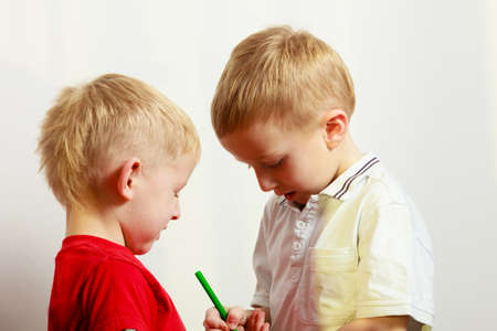 Childhood, relationship between brothers concept. Two little boys siblings playing together having...