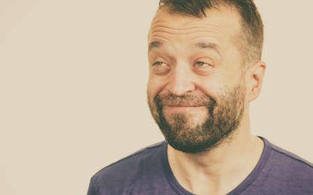 Funny positive guy. Adult man making funny happy positive face expression smiling wide.の写真素材