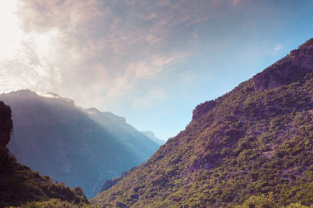 Big huge mountain against summer sky with clouds. Beauty in nature concept. Landscape and scenic concept.の写真素材