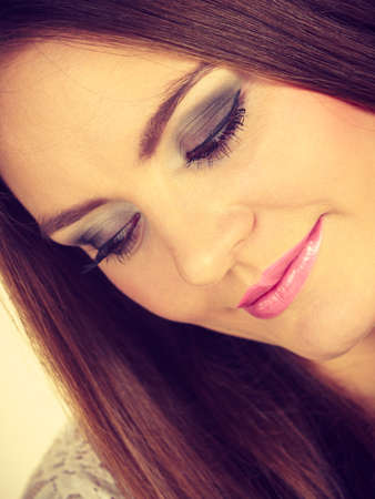 Beauty of feminince concept. Portrait of happy, positive attractive woman with long brunette hair.の写真素材