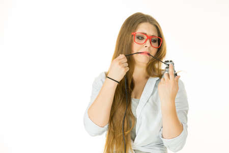 Young woman trying to figure out video console joystick pad. Female understanding gaming