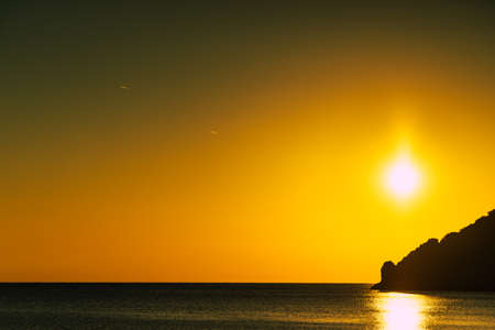 Scenic sunset or sunrise over sea surface. Natural scenery, beautiful landscape