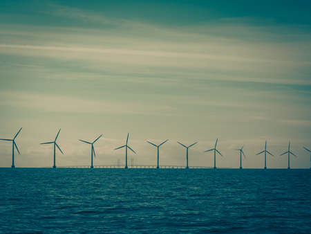 Wind turbines generator farm for renewable sustainable and alternative energy production along coast...