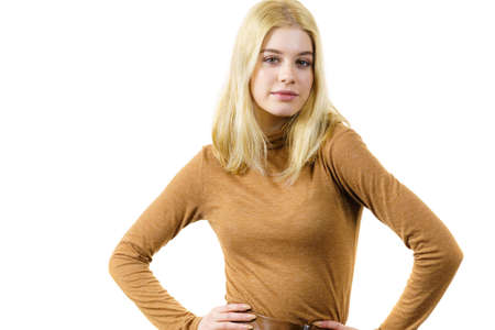 Beautiful pretty woman wearing brown golf suede top. Female having fashionable outfit.の写真素材