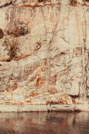 Minimalist shot of rock stone wall and water. Beauty of nature concept.の写真素材