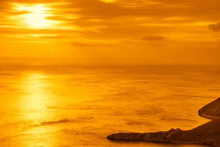 Scenic sunset or sunrise over sea surface. Natural scenery, beautiful landscapeの写真素材