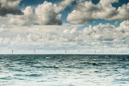 Vertical axis wind turbines generator farm for renewable sustainable and alternative energy production along coast baltic sea near Denmark. Eco power, ecology.の写真素材