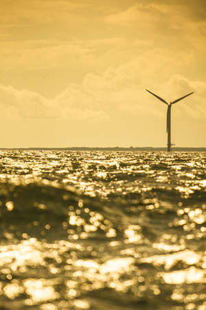 Wind turbines generator farm for renewable sustainable and alternative energy production along coast baltic sea near Denmark. Eco power, ecology.の写真素材