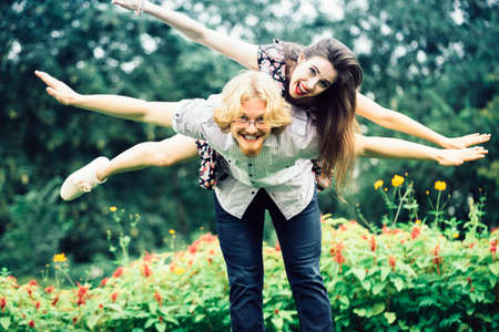 Happy couple having fun together outdoor. Happines, great relationship. Man and woman fooling around.の写真素材