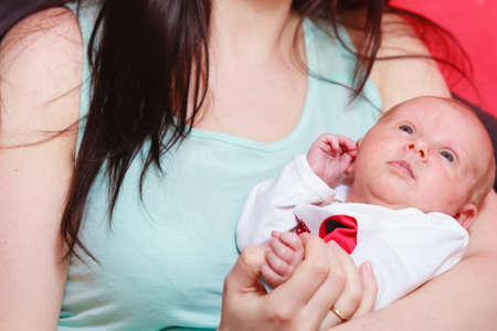 Family parenting, beauty of motherhood concept. Mother holding her little newborn babyの写真素材