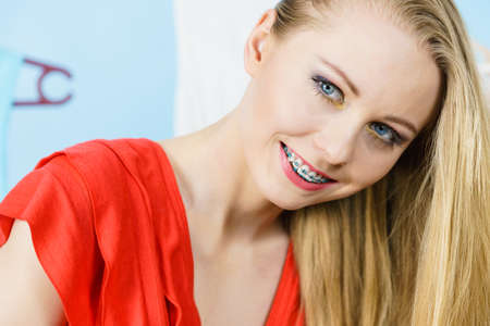 Woman in shop or wardrobe picking clothes from hangers, making perfect outfit. Fashion and style...