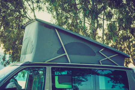Green tent on top of the camper. Camping objects and details concept.の写真素材