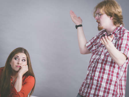 Couple fighting blaming each other. Man and woman having relationship love problems.の写真素材