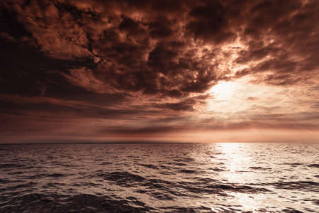 Colorful sunset over evening sea horizon, clouds sky. Tranquil scene. Natural background. Landscape....