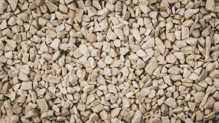 Detailed close up of texture pattern with brown black little stones and rocks. Abstract background...