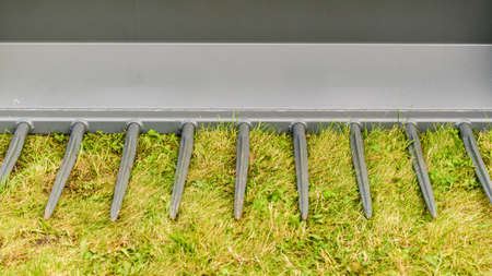 Close up of truck shovel with rake endings. Industrial, agricultural objects details concept.