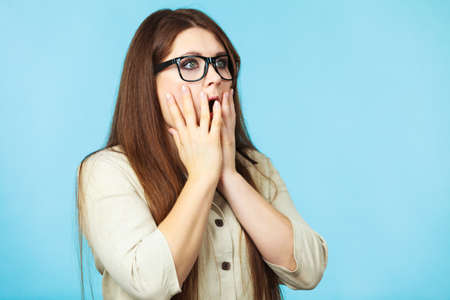 Shocked and surprised young woman. Face expression, human emotions.