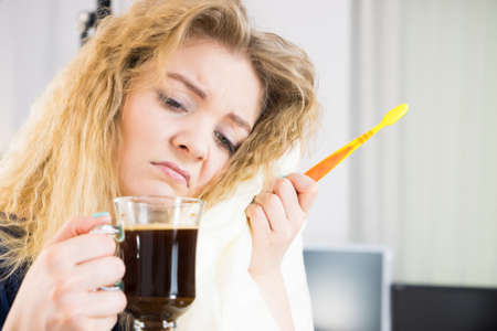 Funny woman holding black coffee and toothbrush being late. Getting morning energy, hurry up before...