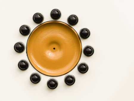 Close up of yellow detailed black bolts screws on car truck wheel. Abstract background concept.