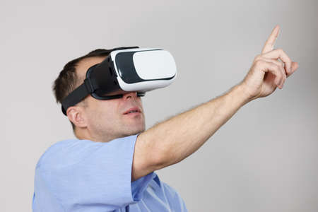 Business man wearing virtual reality goggles headset, vr box. Connection, technology, new generation...