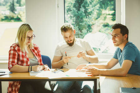 Group of young people sitting in class planning concept, studying together creating new startup...