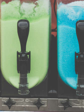 Close up of slush machine. Slushy ice made colorful drink refreshing during summerの写真素材