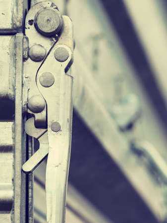 Close up on industrial metal made handle lock for opening semi trailerの写真素材