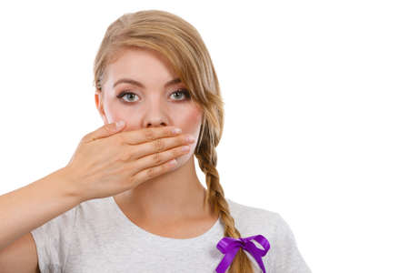 No freedom of speach, shame, sadness concept. Sad woman covering mouth with hand.の写真素材