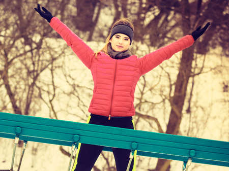 Outdoor sport exercising, sporty outfit ideas. Woman wearing warm sportswear urban training...