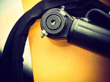 Construction machines concept. Detailed closeup of screw and bolts on indrustrial machinery