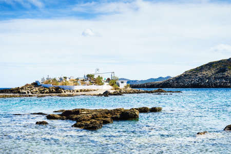 Agios Fokas region of Monemvasia. Greek coastline with small cemetery on sea shore, Maleas peninsula region Peloponneseのeditorial素材